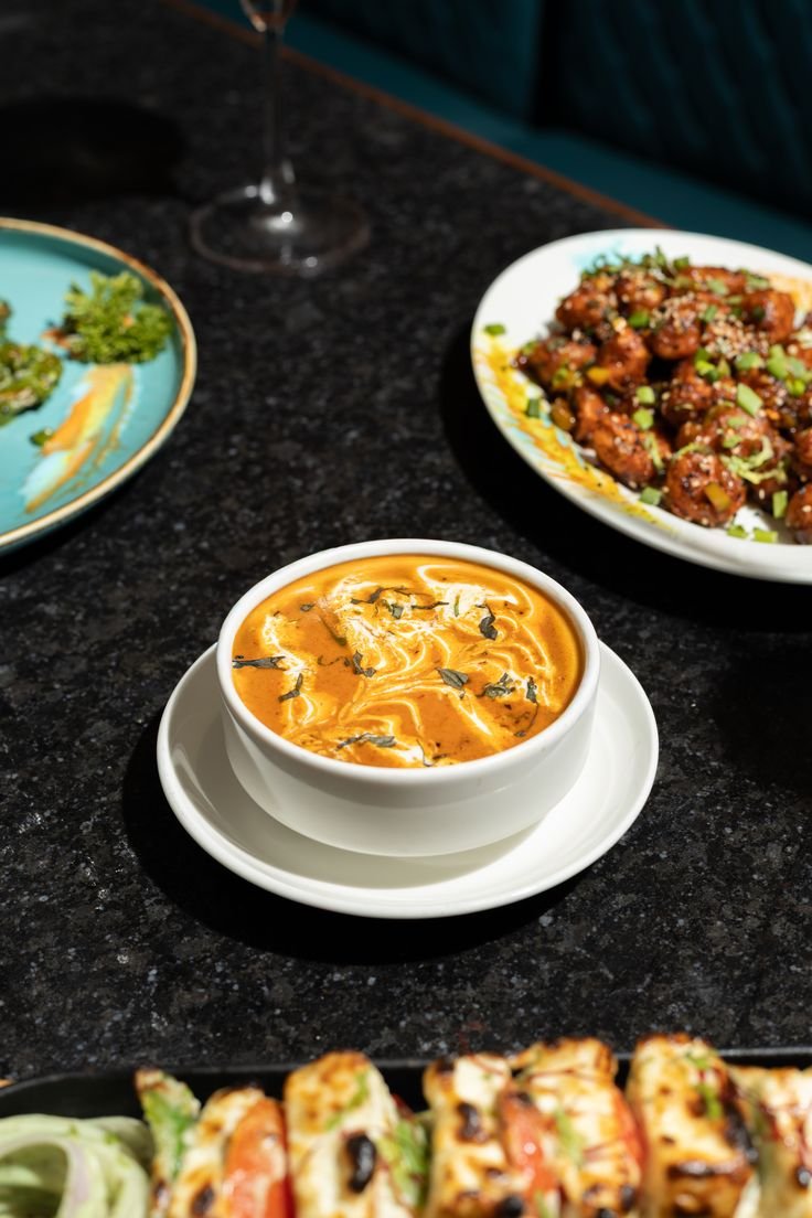 Table spread of Indian dishes